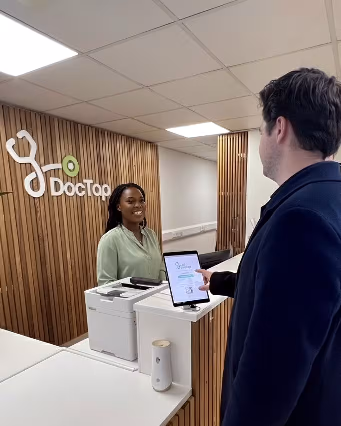 Patient checking in for their appointment at reception