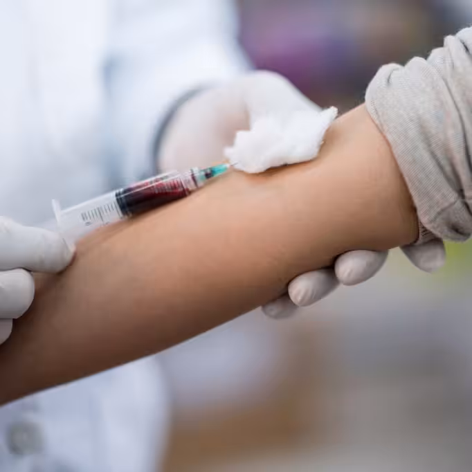 Patient having blood test done as part of the health screen appointment