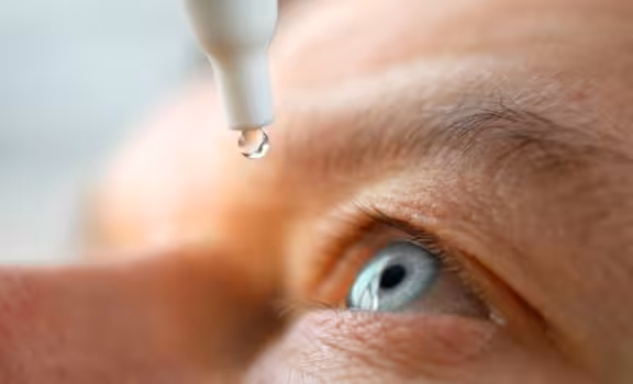 image of patient putting in eye drops
