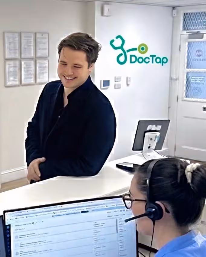 Patient checking in for their appointment at reception